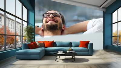 Handsome smiling bearded adult clerk person arms crossed Wall mural