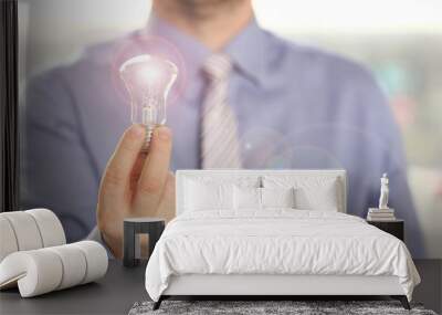 Innovation Technology New Creative Business Idea. Businessman in Shirt Hold Traditional Light Bulb. Married Executive Manager with Lamp in Hand. Saving Energy and Accounting Finance in Office Concept Wall mural