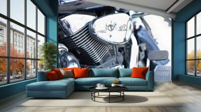 Metallic shiny parts of black motorcycle on street. Motorcycle races and travel around the world concept Wall mural