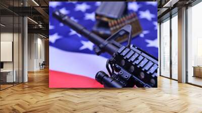 An American-made automatic carbine rifle over the US flag with stacks of ammunition rounds.  A concept image for gun control, home security, personal protection, and the US military power. Wall mural