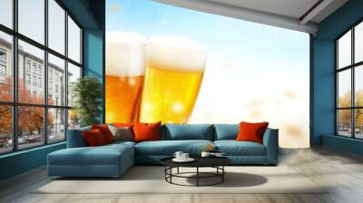 Two glasses of cold beer with a blurry autumn background. Wall mural