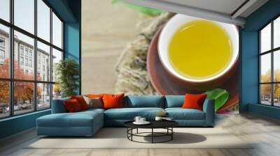 Tea cup fresh green tea on wooden, deatail Wall mural