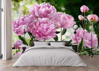 Bouquet of Pink Peonies closeup on a blurred green background Wall mural