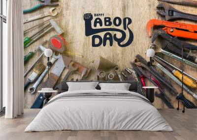 Happy labor day text with old set of work tool. Wall mural