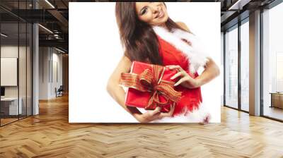 Woman wearing santa claus and holding red gift on white backgrou Wall mural