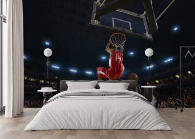 Basketball players on big professional arena during the game. Tense moment of the game. View from below the basket Wall mural