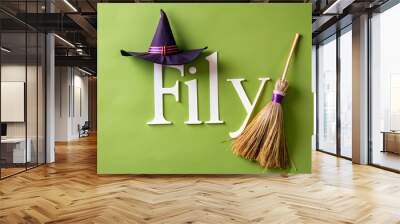 Flat Witchs Broom and Hat with Fly Text concept as An isolated vector featuring a witchs broom and hat with the word Fly in a whimsical font. The elements are set against a white background perfect fo Wall mural