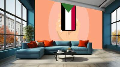 Sudan flag on mobile phone screen, holding smartphone, advertising social media or banner concept Wall mural