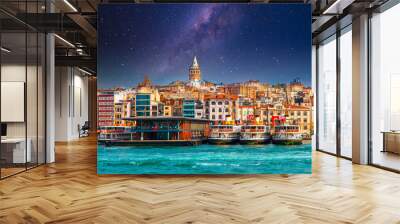 Galata Tower in istanbul City of Turkey. View of the Istanbul City of Turkey with bosphorus, seagulls and boats at bright sky and sunset or night. 	 Wall mural