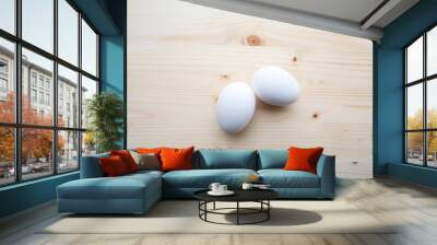 Two white egs on a wooden background. Wall mural