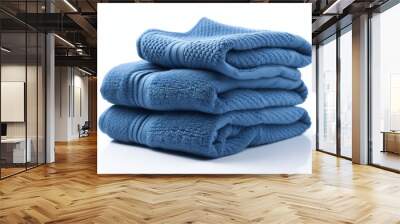 Folded blue towels isolated on white background, close up Wall mural