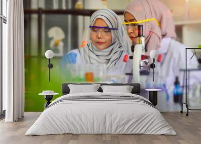 Muslim portrait of woman scientist working together in a laboratory for halal food close up viwe, concept of  health care, Wall mural