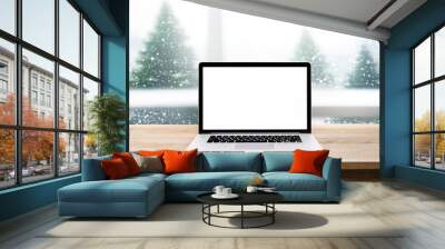 Computer,laptop with blank screen on snowfall in white.christmas winter backgrounds Wall mural