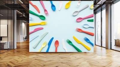 Top view of colorful spoon and fork element on color table.flat lay Wall mural