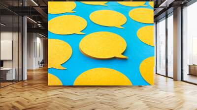 Yellow chat,speech bubble icons on blue color background.Talking and  message for social media concepts Wall mural