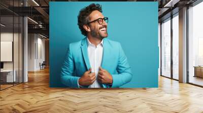 40 years old ultra handsome Caucasian, smiling and laughing, wearing bright clothes. Bright solid blue background. created by generative AI technology. Wall mural