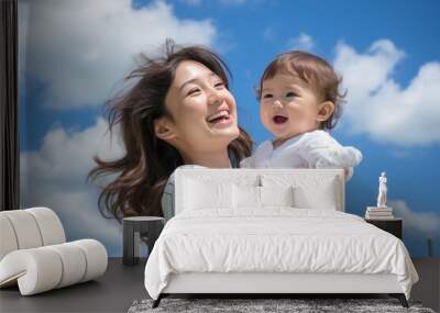 Cute Japanese mother with baby, blue sky background. created by generative AI technology. Wall mural