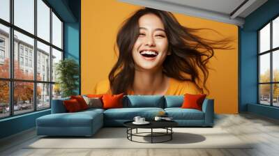 happy fashion smiling girl with bright clothing in solid light background Wall mural