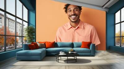 happy handsome fashion African American man smiling and wearing color cloth, solid light color background Wall mural