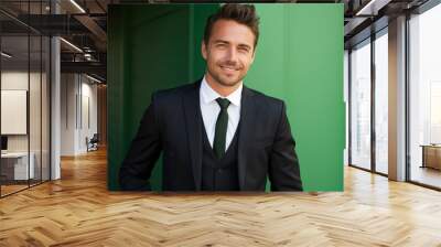 happy handsome fashion businessman smiling and wearing black suit, Bright solid light background Wall mural