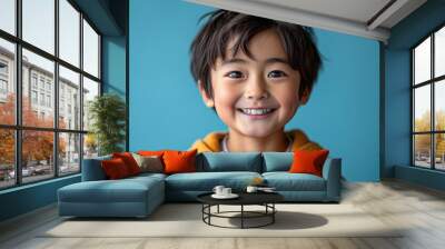 happy smiling asian kid in a professional studio background Wall mural