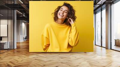 Happy young girl, who is smiling and laughing, wearing bright clothes. Bright solid background. created by generative AI technology. Wall mural