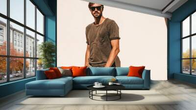 portrait of handsome confident stylish hipster lambersexual model.man dressed in t-shirt. fashion ma Wall mural