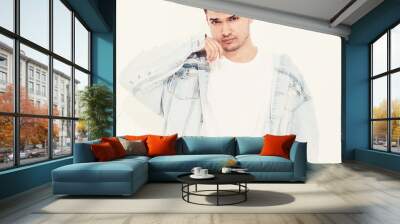 Portrait of handsome young model man dressed in jeans clothes posing on white background. Isolated Wall mural