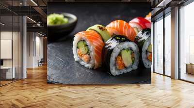 fresh sushi gourmet with black stone plate shiny, salad green leaf and wasabi, with dark ambient background Wall mural