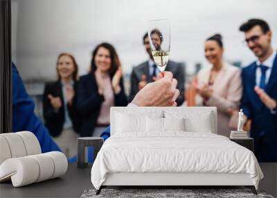 A group of joyful businesspeople having a party outdoors on roof terrace in city. Wall mural