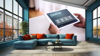 A tablet with smart home screen. Wall mural