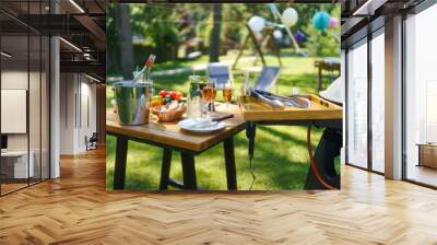 Close up shot of a grill and table at a summer garden party. Wall mural