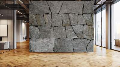 Close-up texture of stone paving or wall. Natural stone background suitable for design and decor. Wall mural