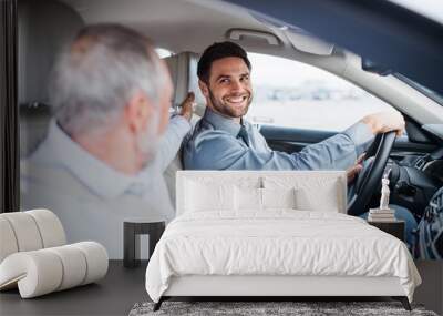 Father and son sitting in car, driving and talking. Wall mural