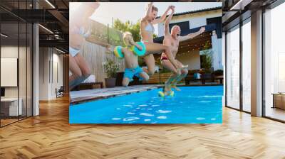 Generation family having fun together when jumping into the swimming pool at backyard. Wall mural