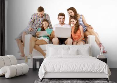 group of young people on sofa with tablet Wall mural