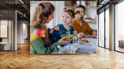 Happy family having Easter dinner together in their home. Wall mural