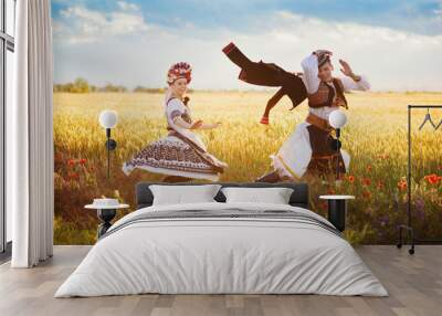 Love couple is dancing in the field Wall mural