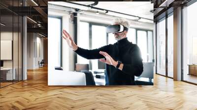 Mature businessman with VD goggles in the office. Wall mural