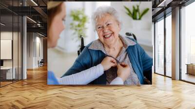 Nurse taking care about senior woman client. Wall mural