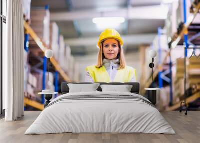 Portrait of a young woman warehouse worker. Wall mural