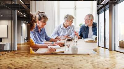 Senior people in bible reading group in community center club. Wall mural