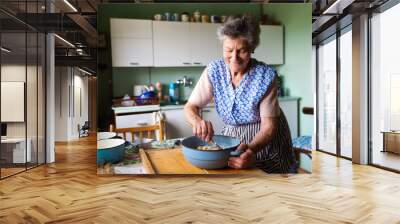 senior woman baking Wall mural