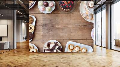 Table with cake, pie, cupcakes, tarts and cakepops. Copy space. Wall mural