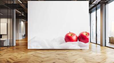 A healthy food plate with red apples on a white cloth background Wall mural