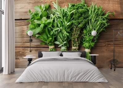 The background is wood with fresh herbs and space for text Wall mural