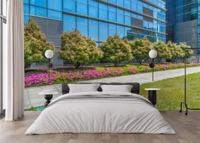 beautiful green meadow near modern office building. Wall mural