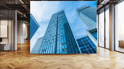 Modern office building against blue sky. Wall mural