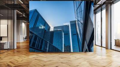 Modern office building against blue sky Wall mural