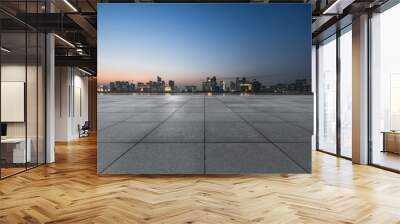 night view of empty brick floor front of modern building Wall mural